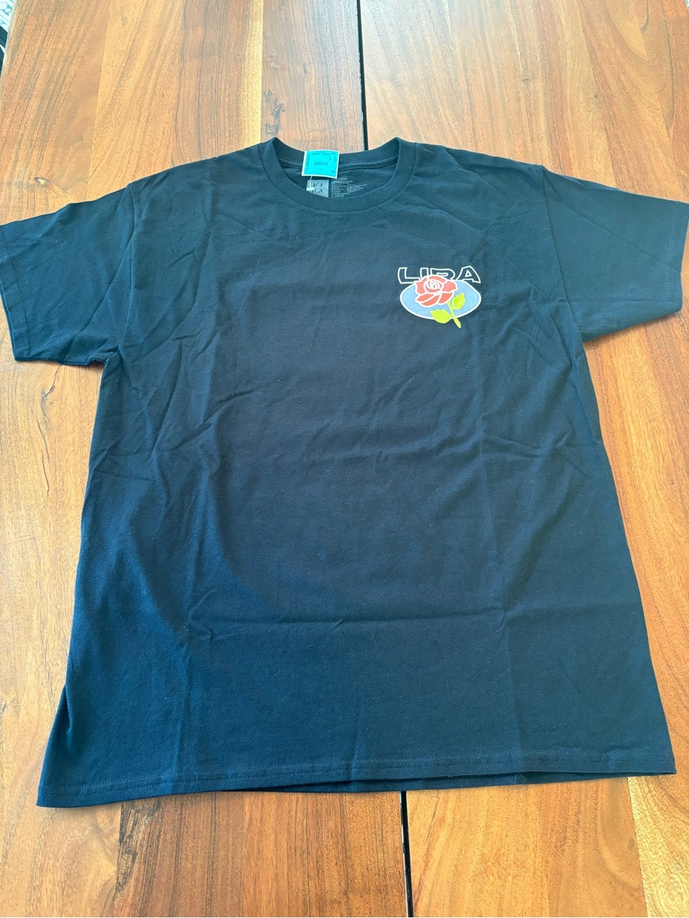 Lira Black Tee with Rose Logo large NWT